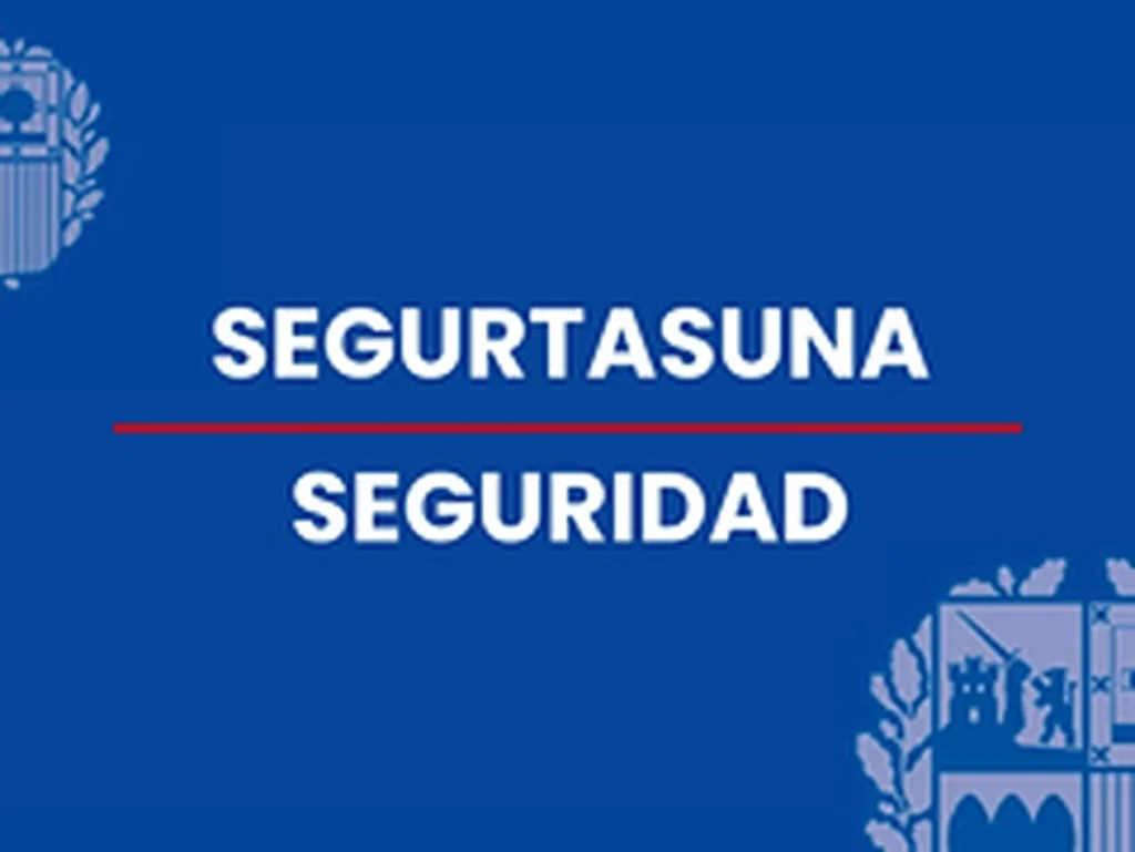 Texto que dice 'SEGURTASUNA SEGURIDAD' en fondo azul.