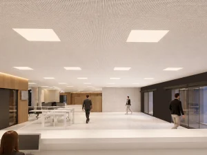 Interior moderno de oficina con personas caminando y luz natural